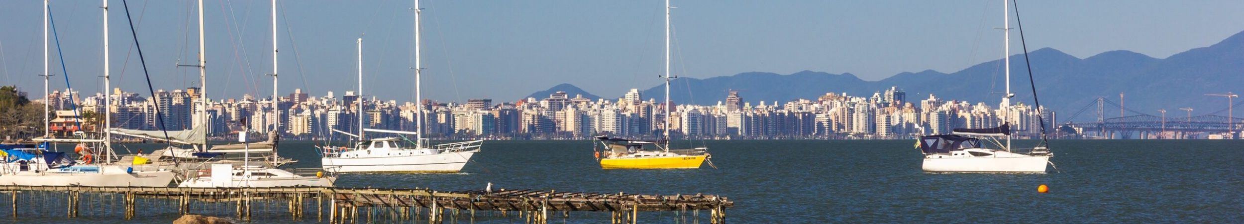 A closeup shot of a bay with sailboats and yachts in Florianopolis, Brazil